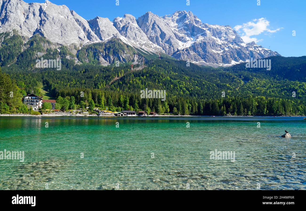 picturesque turquoise lake Eibsee by the foot of mountain Zugspitze in ...