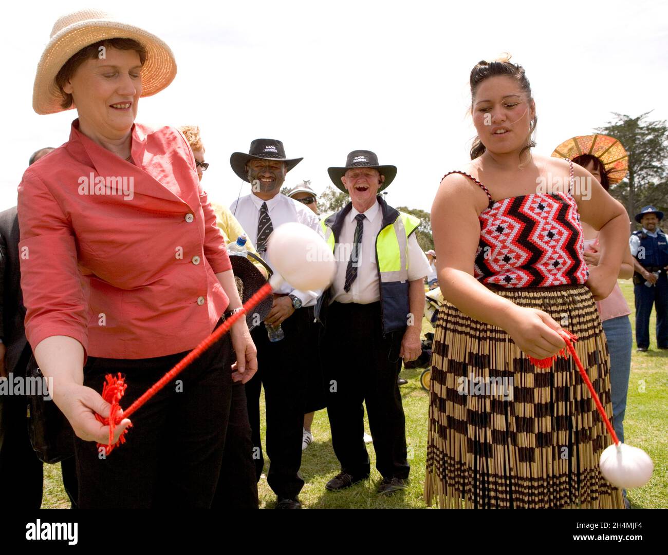 Prime Minister Helen Clark with Katarena Potae of the Te Manuhiua group, Auckland at the Toi O Manukau Waitangi Day Family Celebrations, Hayman Park, Manukau, New Zealand on Tuesday 6 February 2007. Stock Photo