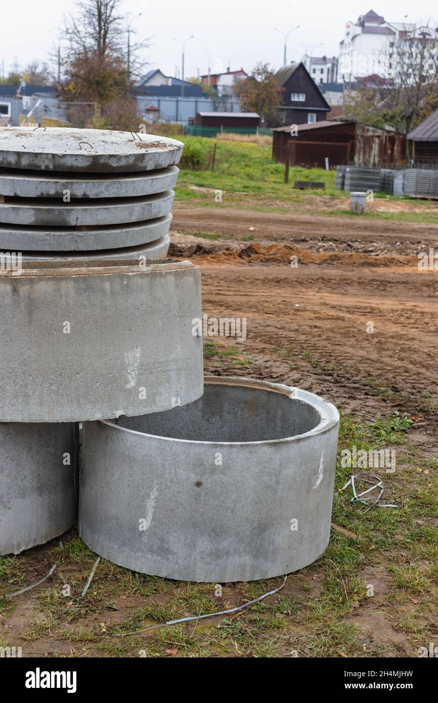 Concrete well rings and slabs at construction site Stock Photo - Alamy