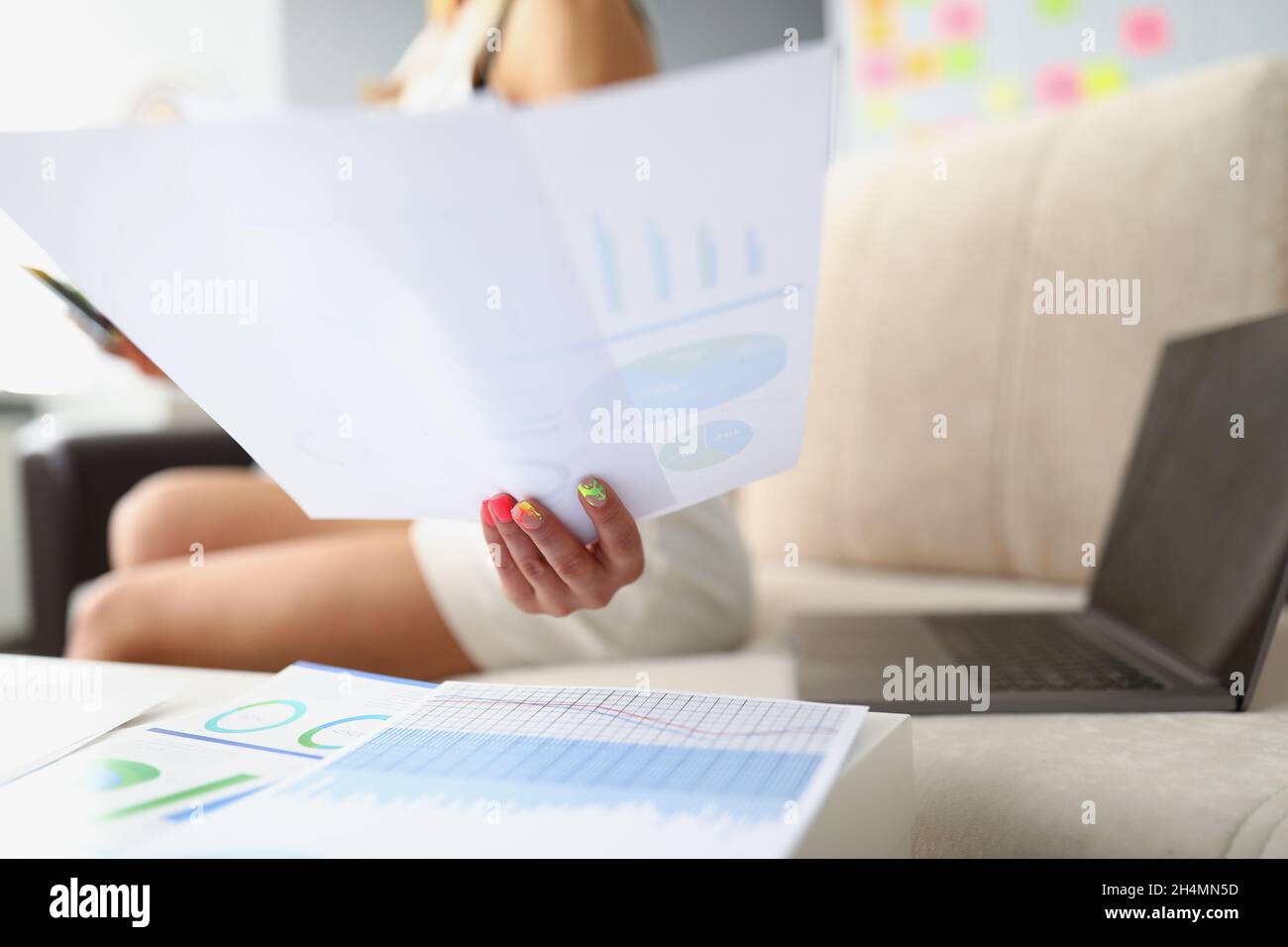 Lady analyze monthly report Stock Photo