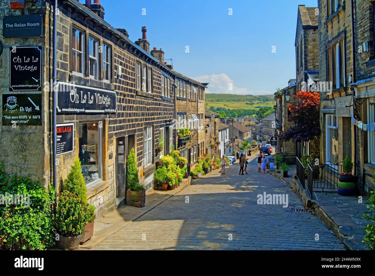 UK West Yorkshire Haworth Main Street Shops And Cottages Stock Photo uk-west-yorkshire-haworth-main-street-shops-and-cottages-stock-photo