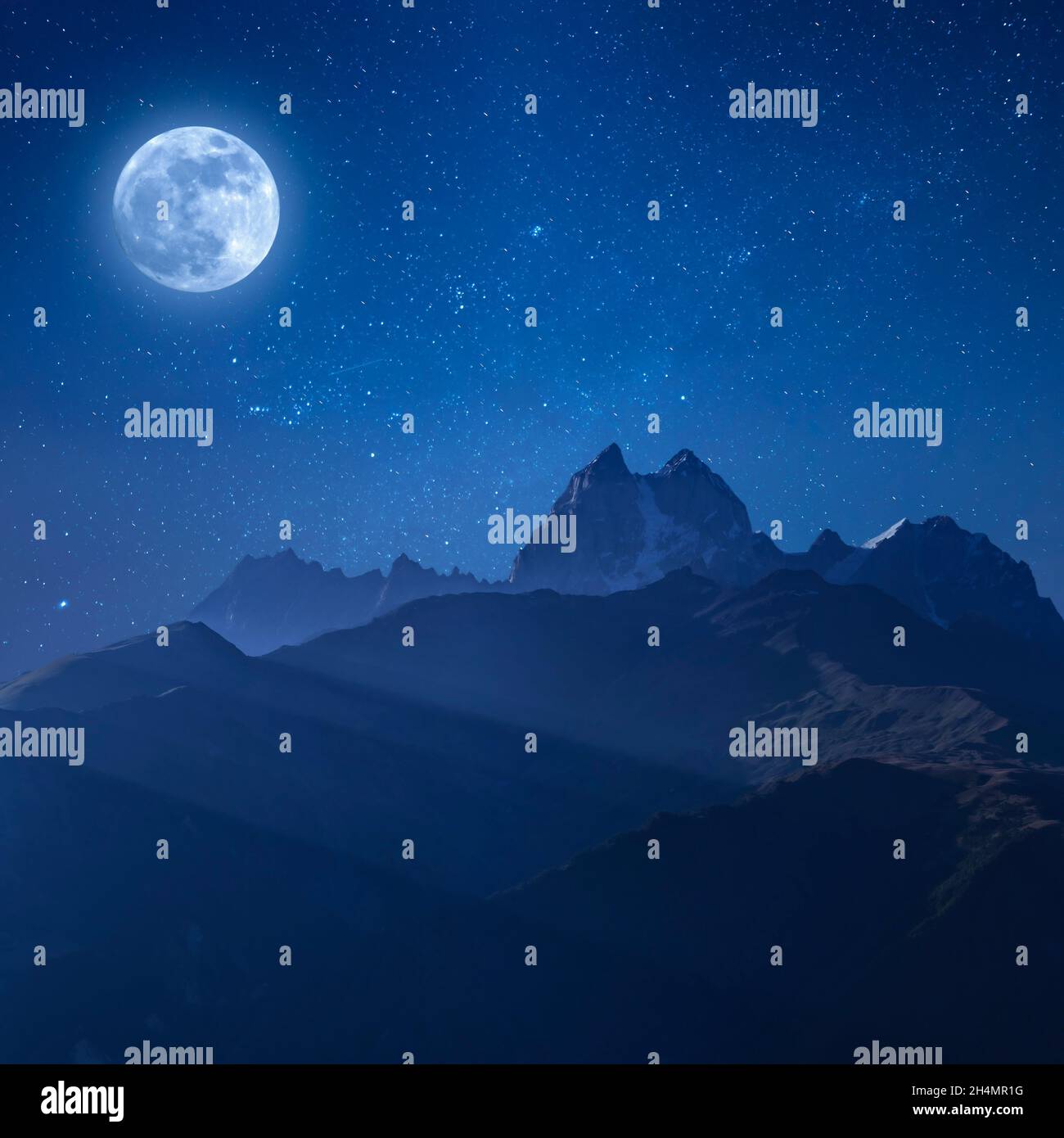 Night landscape with mountains and full moon, bright stars in endless galaxy Stock Photo