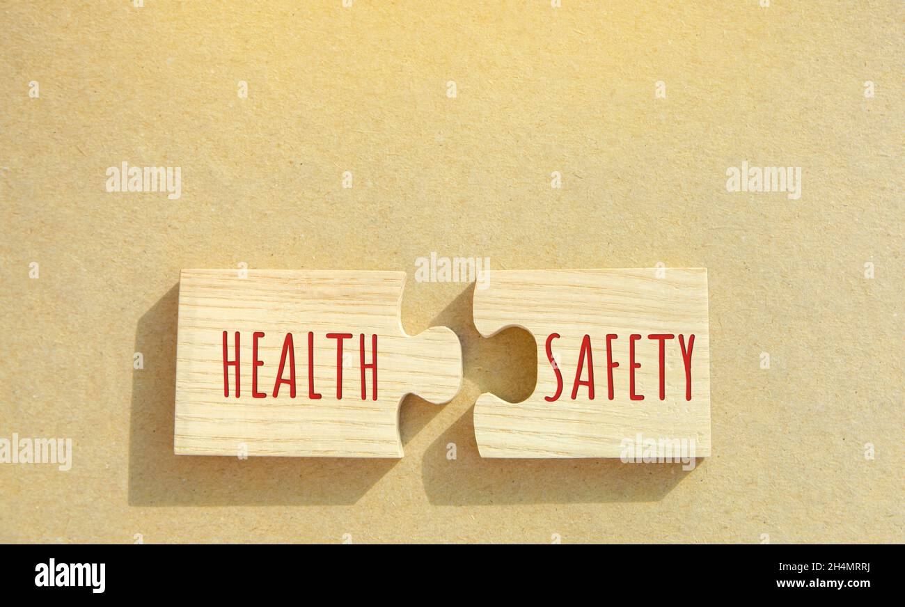 Puzzles with the word Health and Safety. Occupational health and safety systems, protect employees. Safe workplace which uses safe plant and equipment Stock Photo