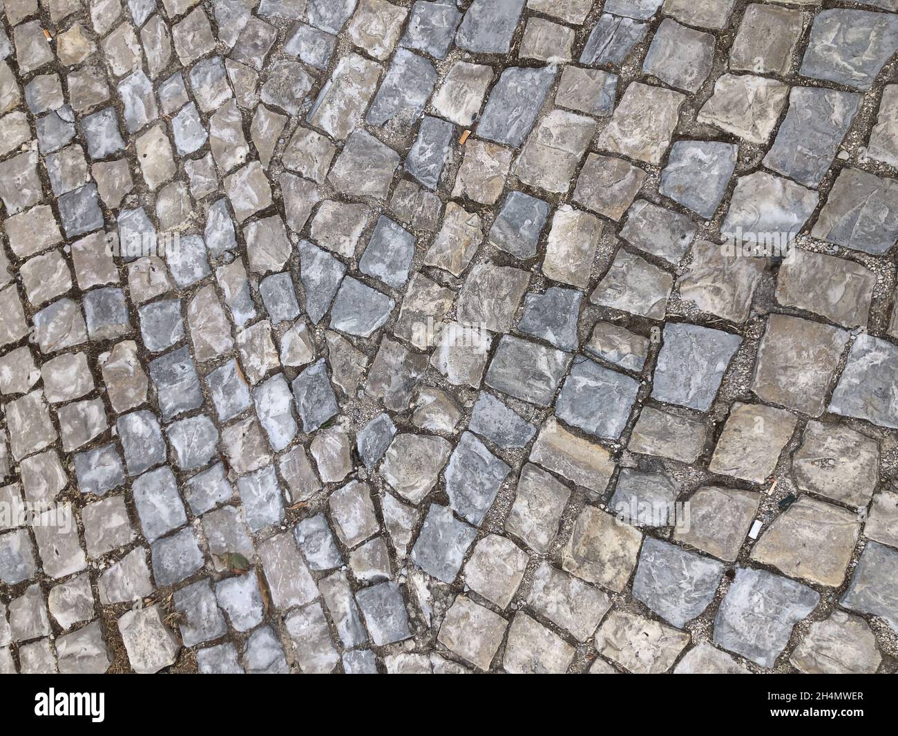 High angle closeup of a stone Road paved texture Stock Photo - Alamy