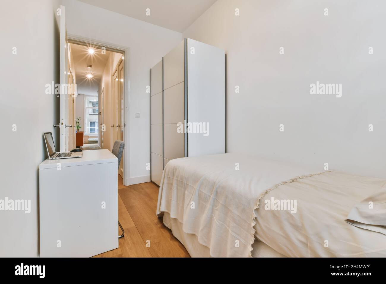 Beautiful image of a fully decorated single bedroom in a white ...