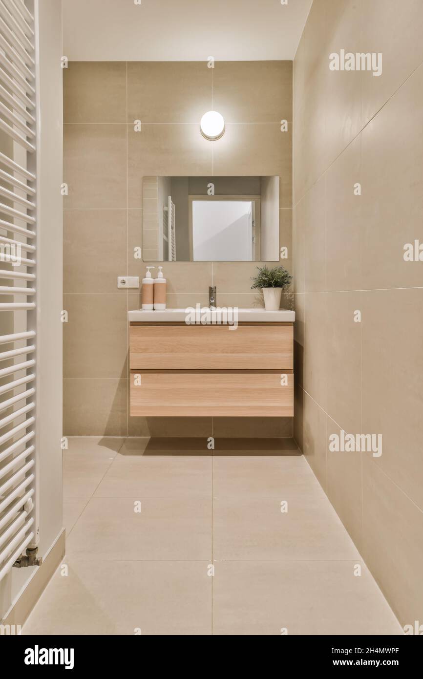 Beautiful image of a modern design bathroom sink in a white interior design house; design ideas