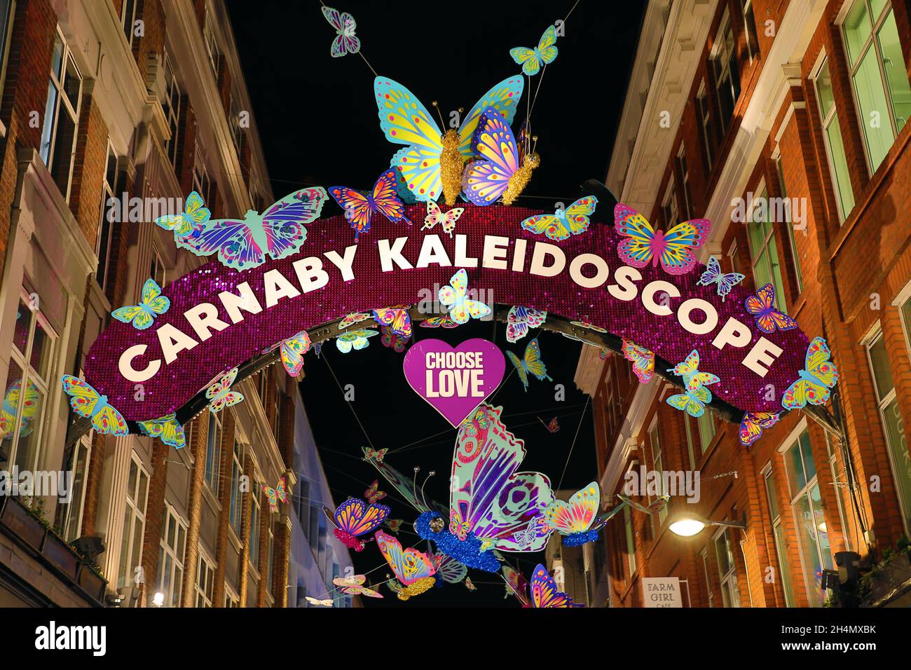 London, UK. 3rd Nov, 2021. Carnaby Street Christmas decorations in London, England with a colourful butterfly theme which is designed as a metaphor exemplifying spiritual rebirth, transformation, change and hope. the installation is in collaboration with the charity Choose Love to raise funds for refugees around the world. Credit: Paul Brown/Alamy Live News Stock Photo