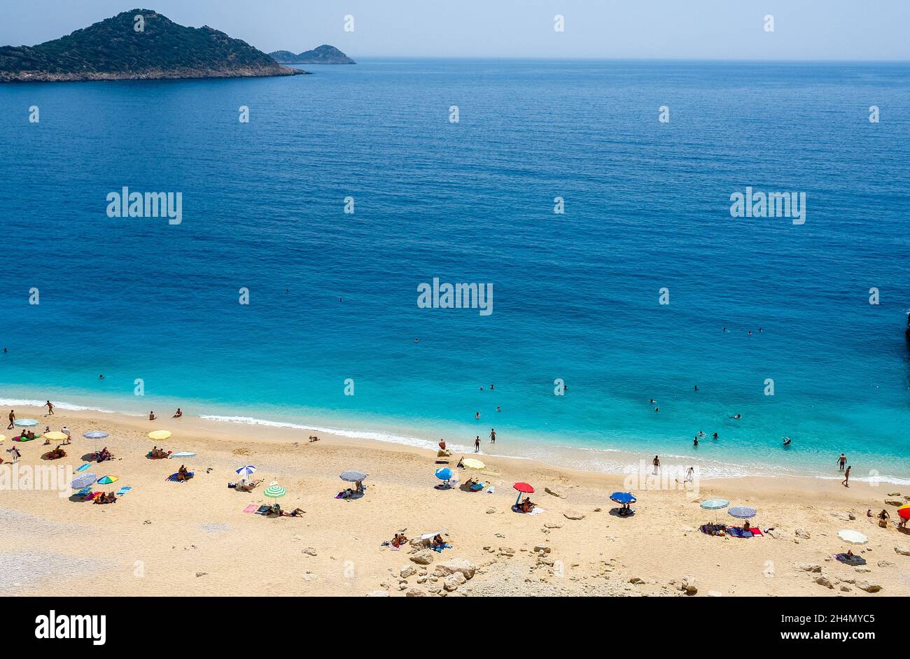 Kaputas beach near Kalkan town in Antalya province of Turkey. View with unidentifiable figures of people. Stock Photo