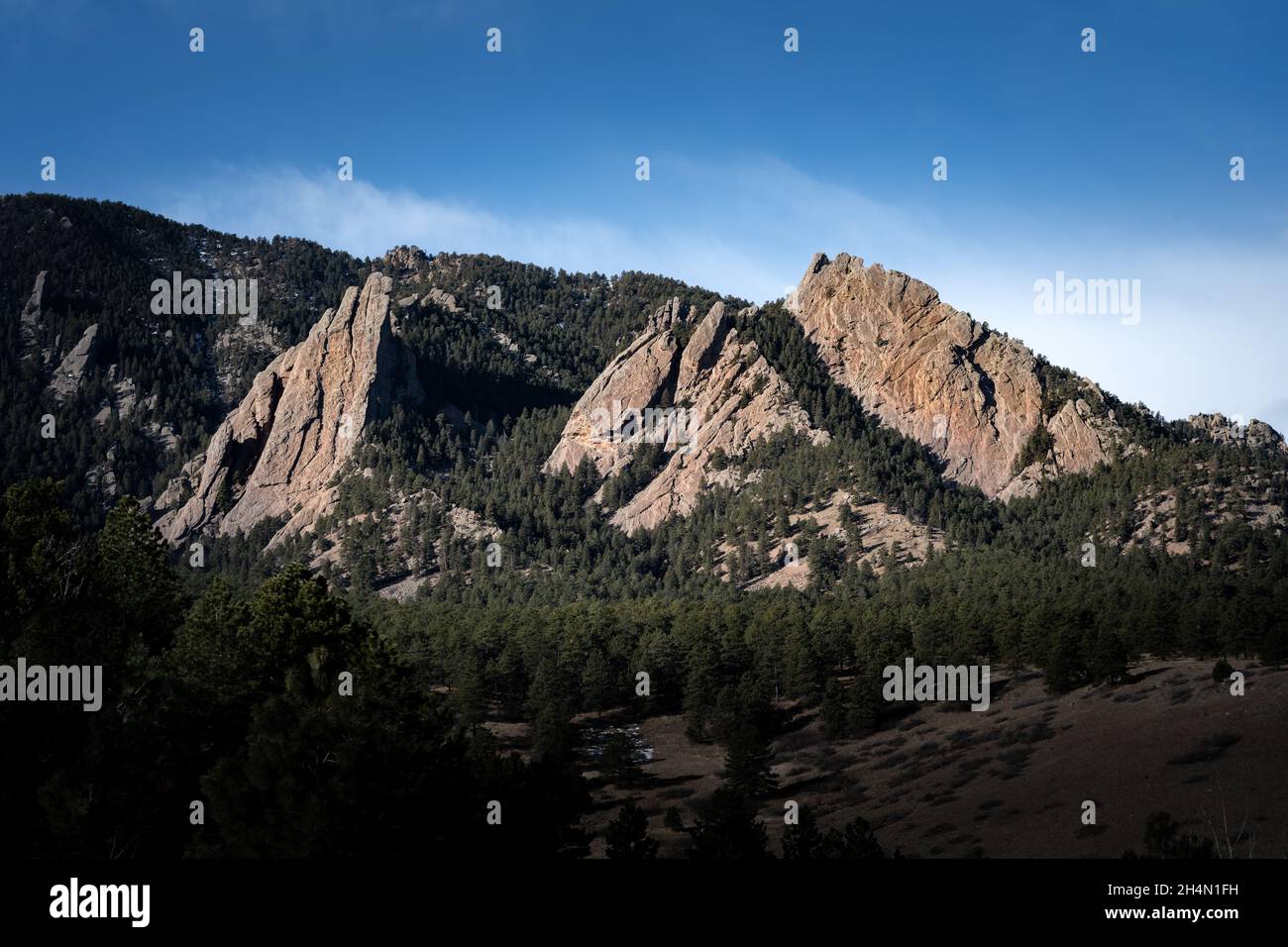 Morning sun hits Boulder, Colorado's Flatirons Stock Photo