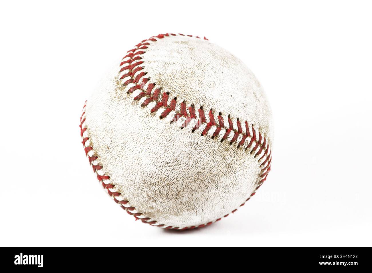 An old baseball in a lightbox Stock Photo