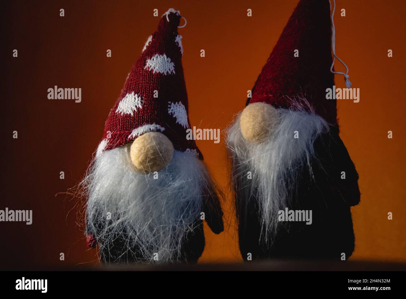 Two red Christmas elves (elf) with red pointy hats and white beards