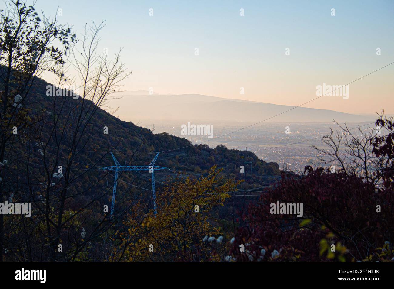 Very polluted air over Nis Serbia .Blue polluted foggy sky of a landscape from Crni Kamen in Suva Planina Nis. Natural wallpaper ultra wide nature Stock Photo
