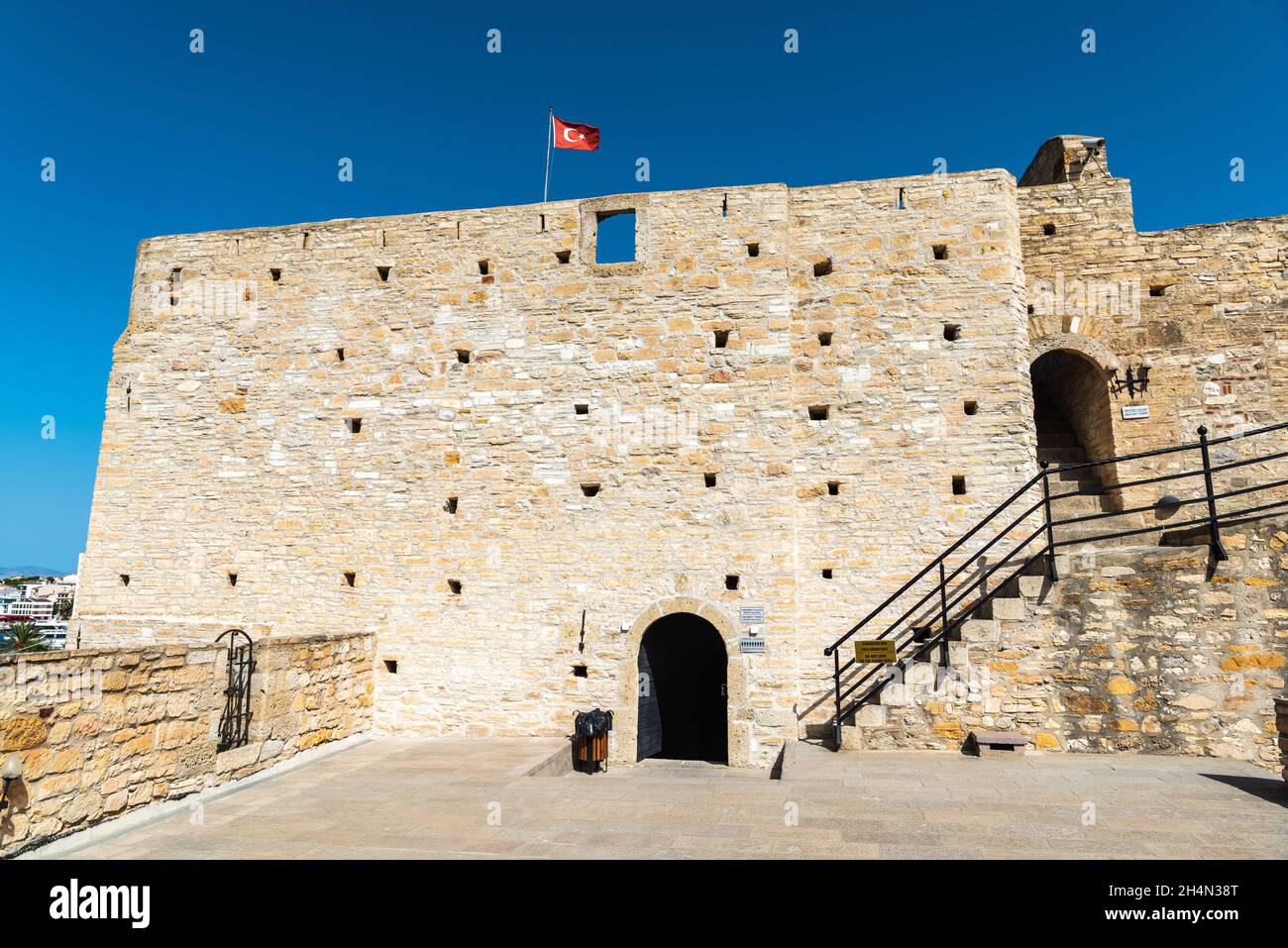 Cesme, Izmir, Turkey – October 4, 2020. Umur Bey tower of the Cesme Fortress in in Cesme resort town of Izmir province in Turkey. The Genoese fortress Stock Photo