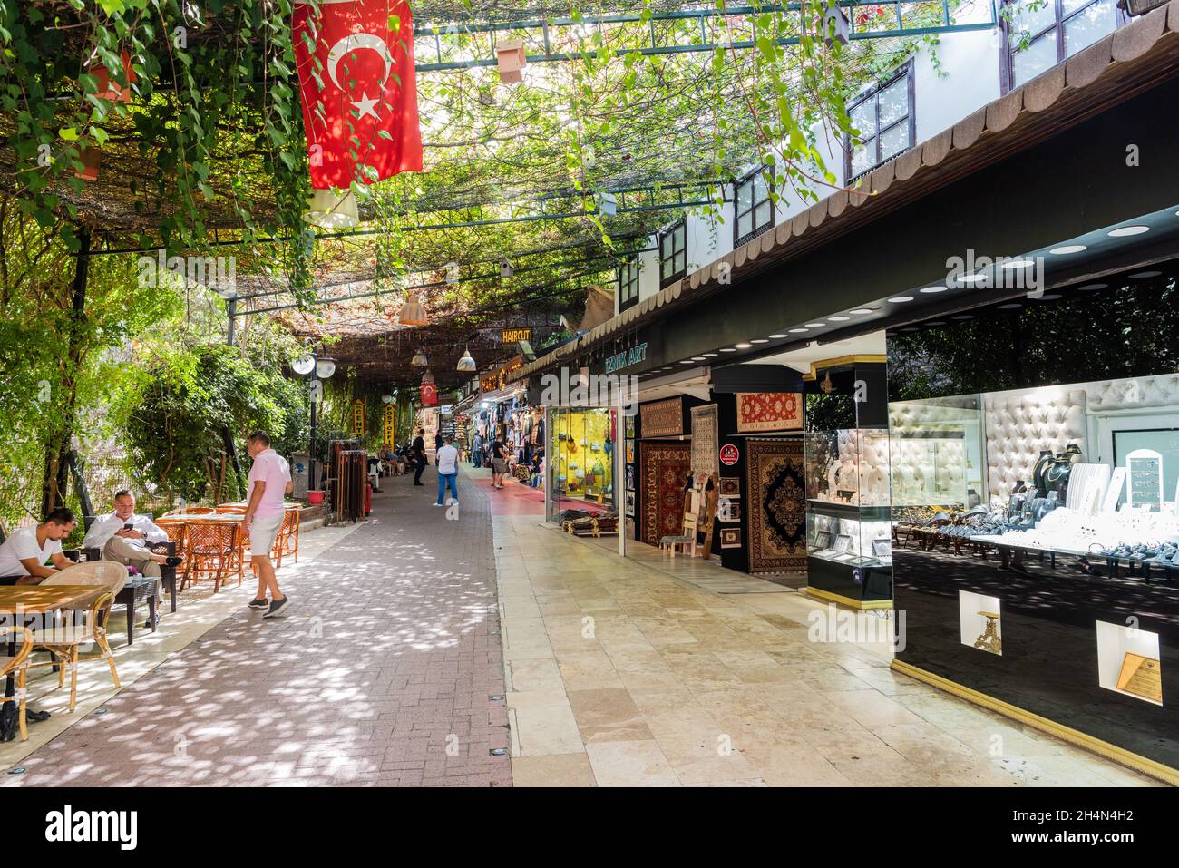 Kusadasi, Aydin, Turkey – October 6, 2020. Old Town Bazaar area in Kusadasi resort town in Turkey. View with shops and people. Stock Photo