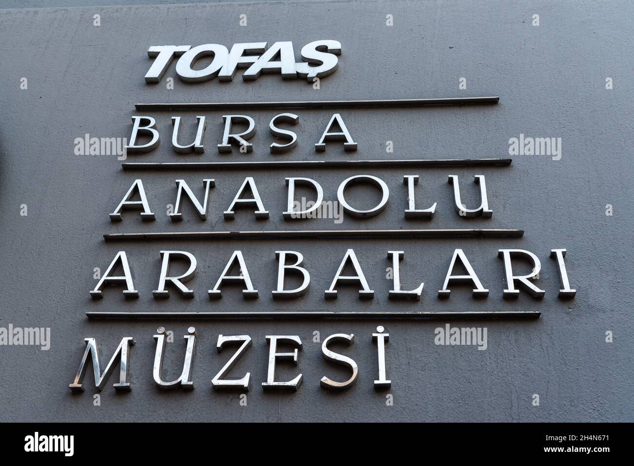 Bursa, Turkey – November 11, 2020. Sign of Tofas Museum of Anatolian Carriages, at the entrance to the museum, in Bursa. The museum houses old cars an Stock Photo