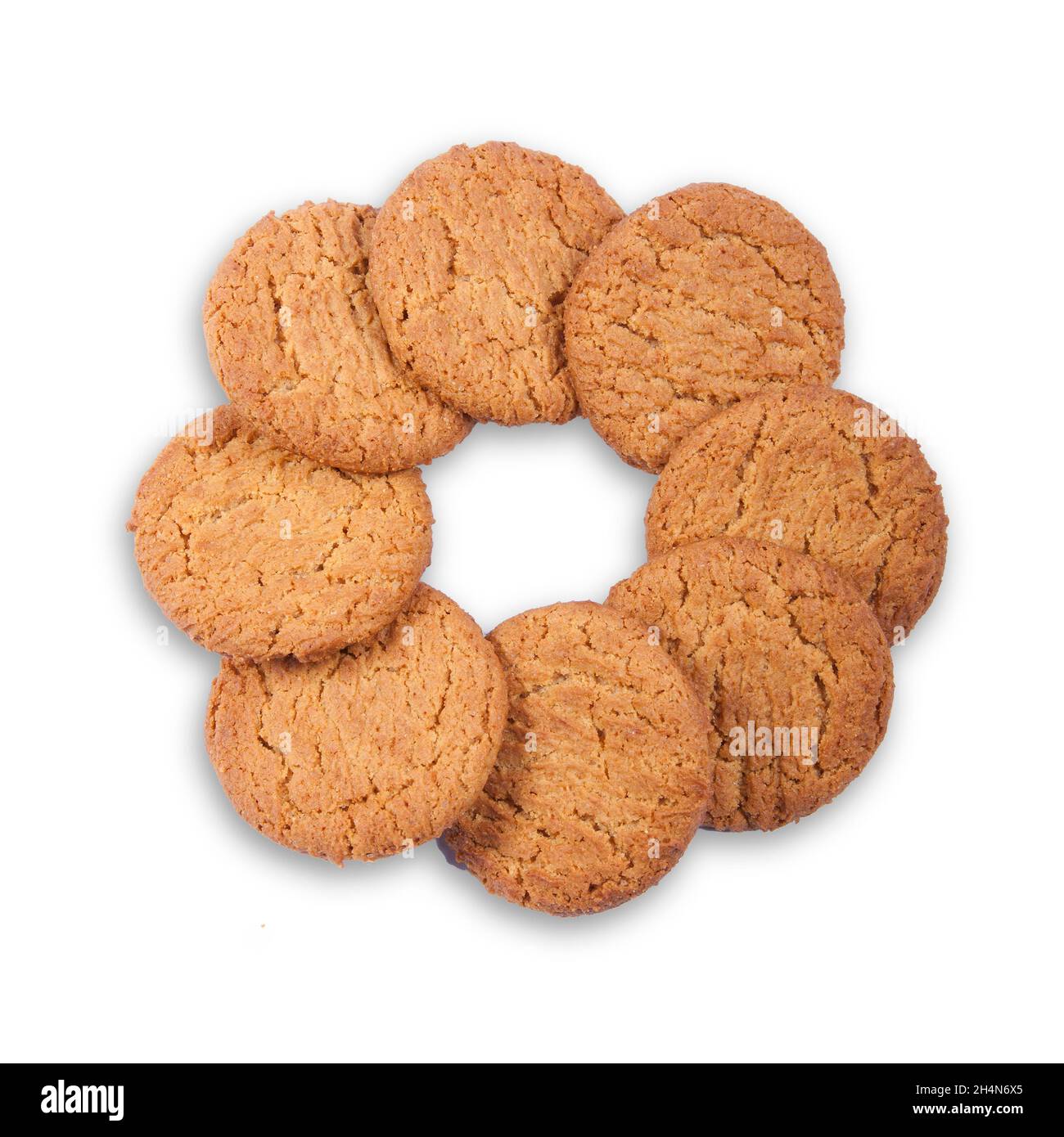Gingernut biscuits in a ring on white Stock Photo