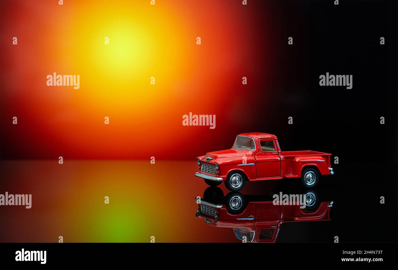 Vintage toy pickup truck on a glossy 