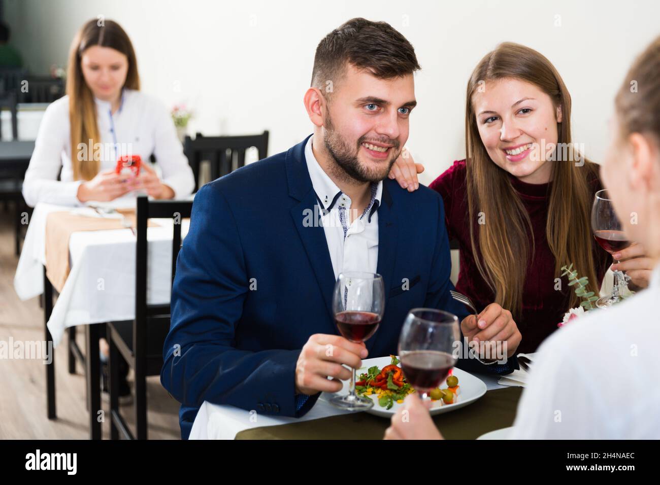 Friends are having dinner in the restaurante Stock Photo
