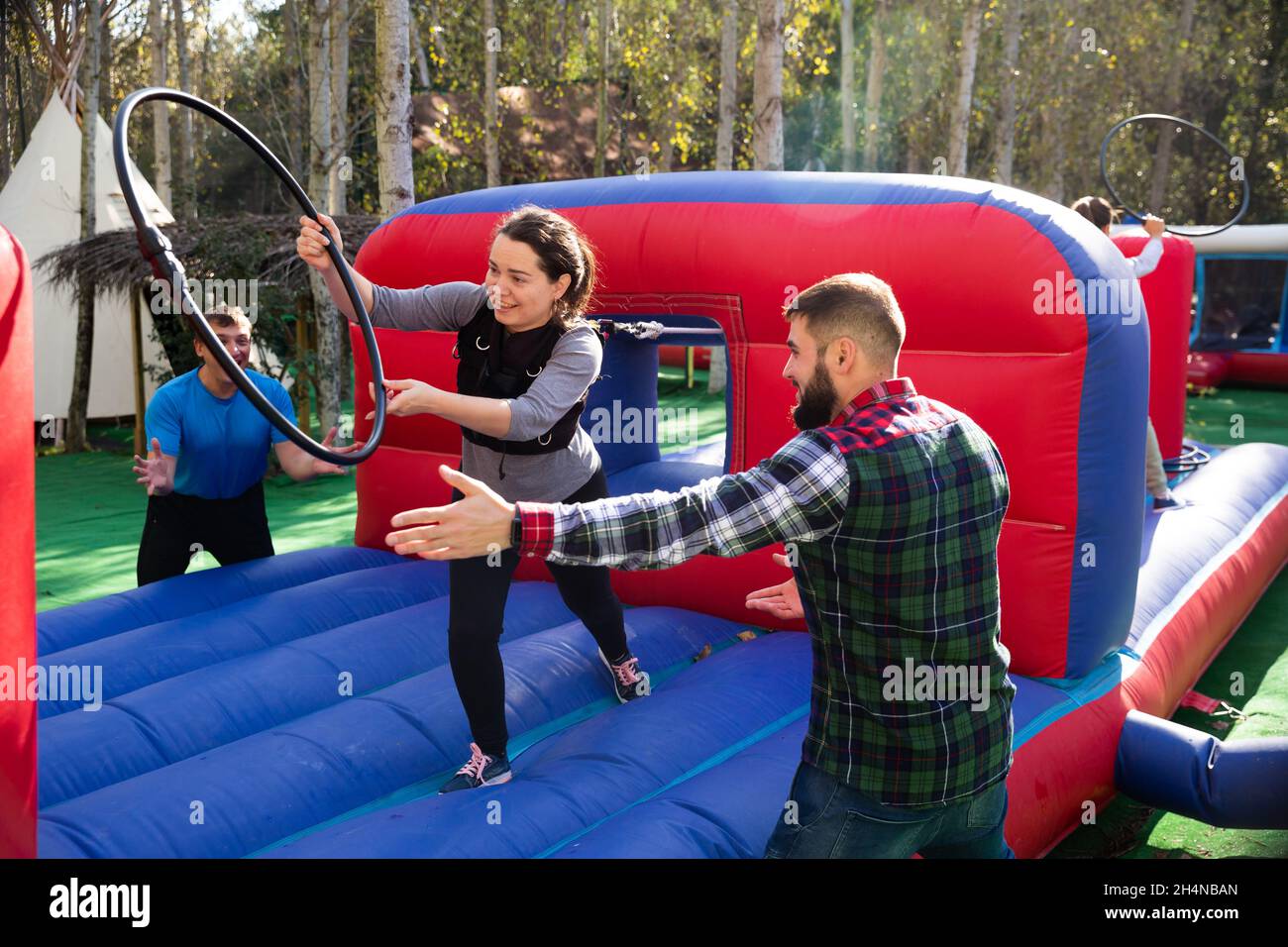 People passing obstacles at amusement park Stock Photo - Alamy