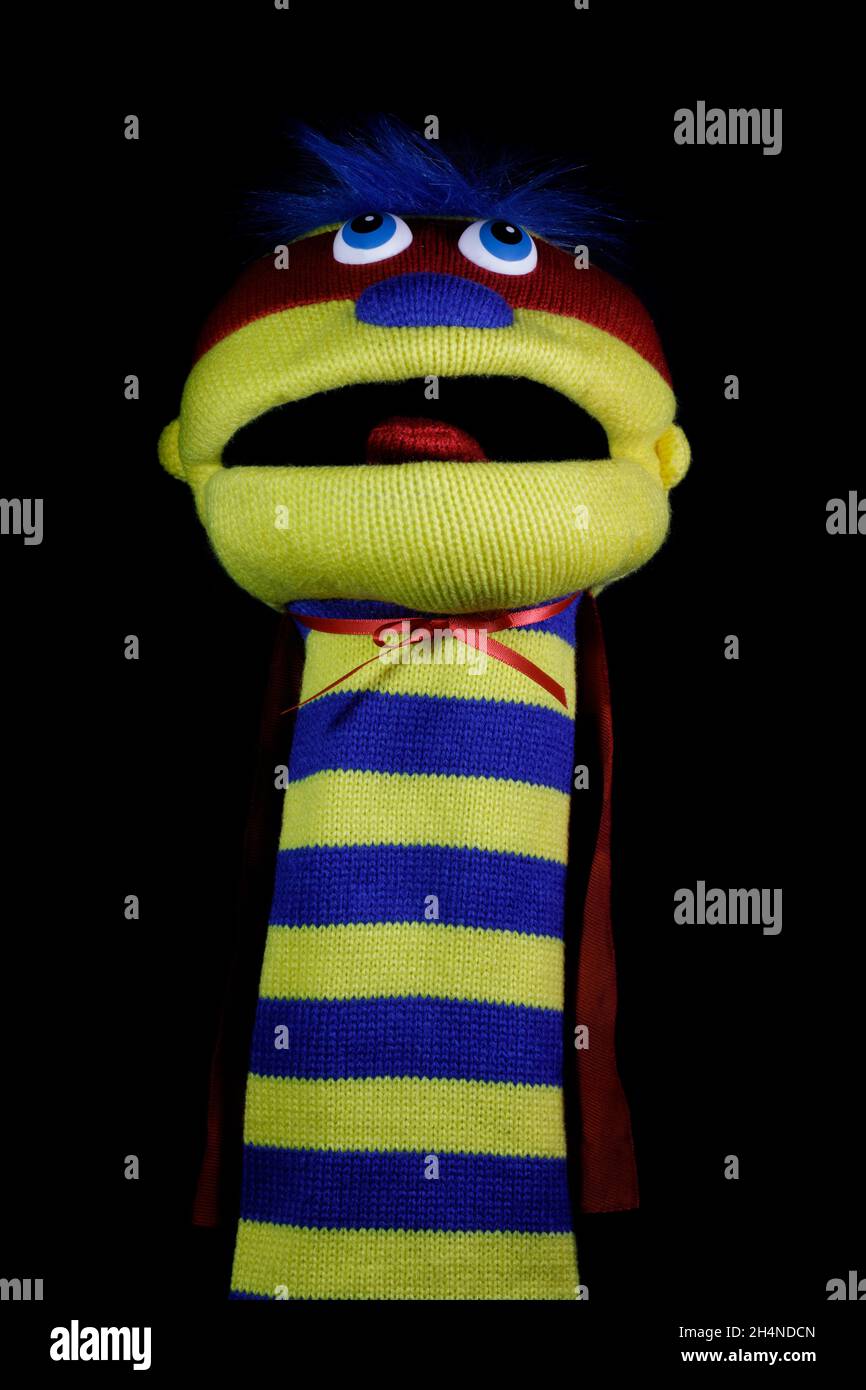 Sock Puppet Isolated Against Black Background Stock Photo