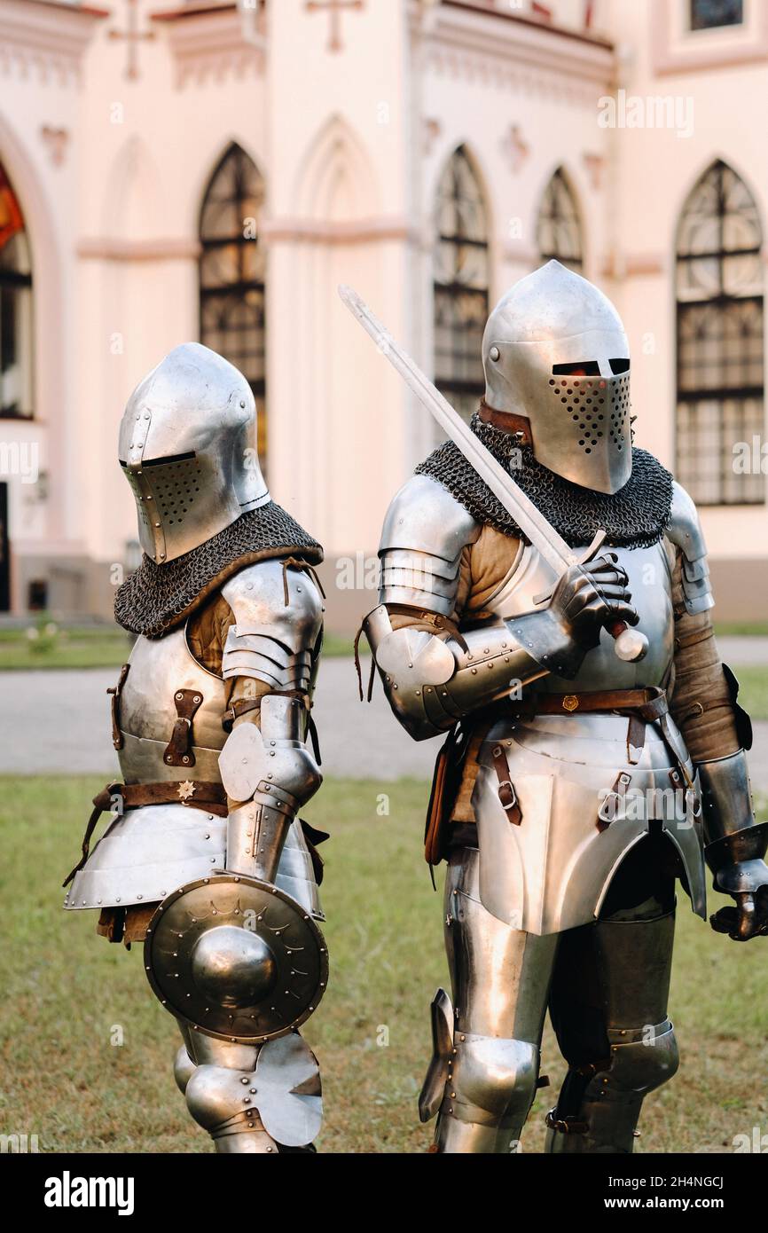 Two knights in armor on the background of the medieval Kossovsky castle ...