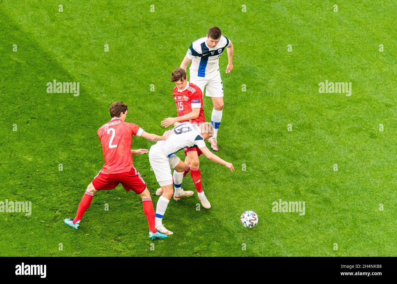 Saint Petersburg, Russia – June 16, 2021. Finland players Jere Uronen and Daniel O'Shaughnessy against Russia players Mario Fernandes and Aleksei Mira Stock Photo