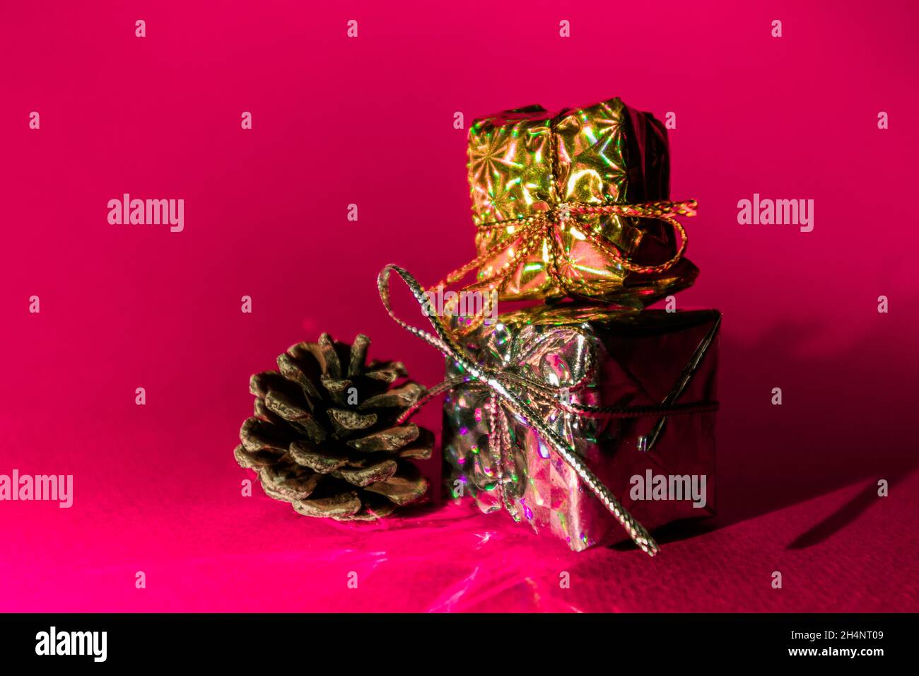 Two New Year's gifts on a pink background. Stock Photo