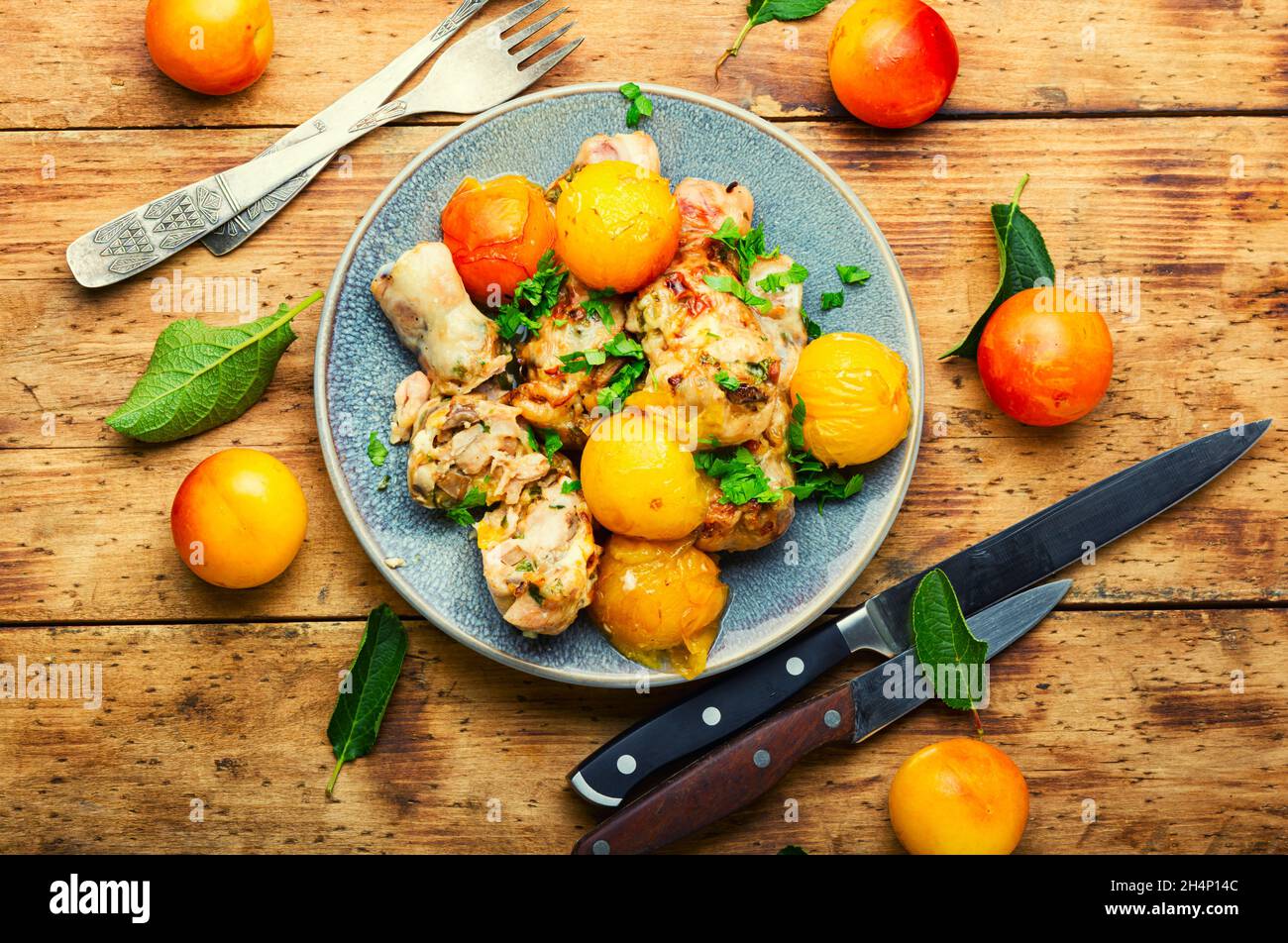 Chicken leg stuffed with mushroom and cherry plum. Baked meat dish with