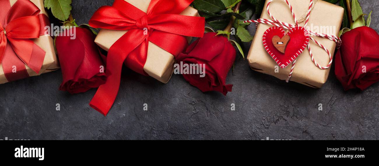 Valentines day greeting card with rose flowers bouquet and gift boxes ...