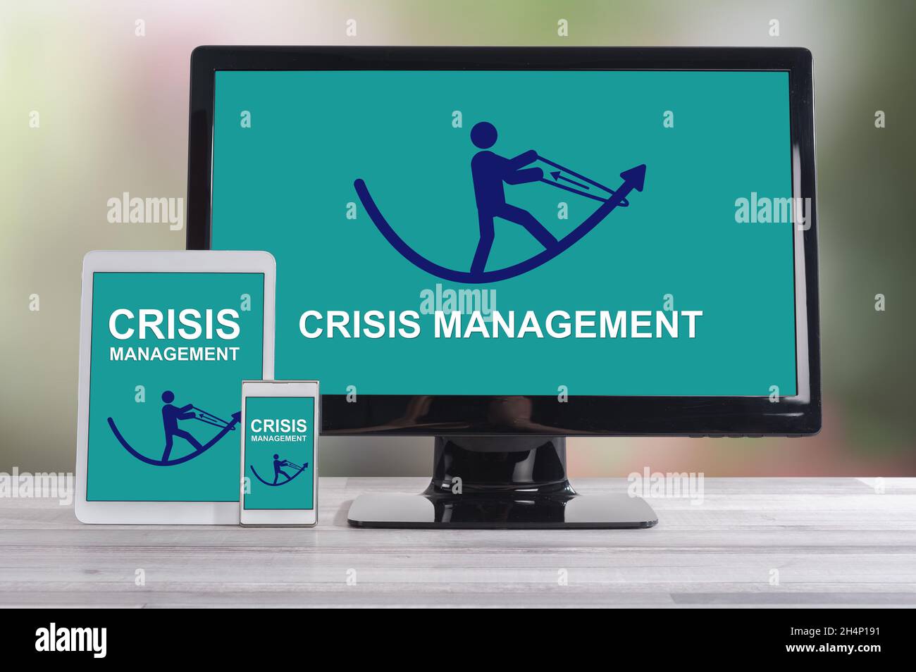 Crisis management concept shown on different information technology devices Stock Photo