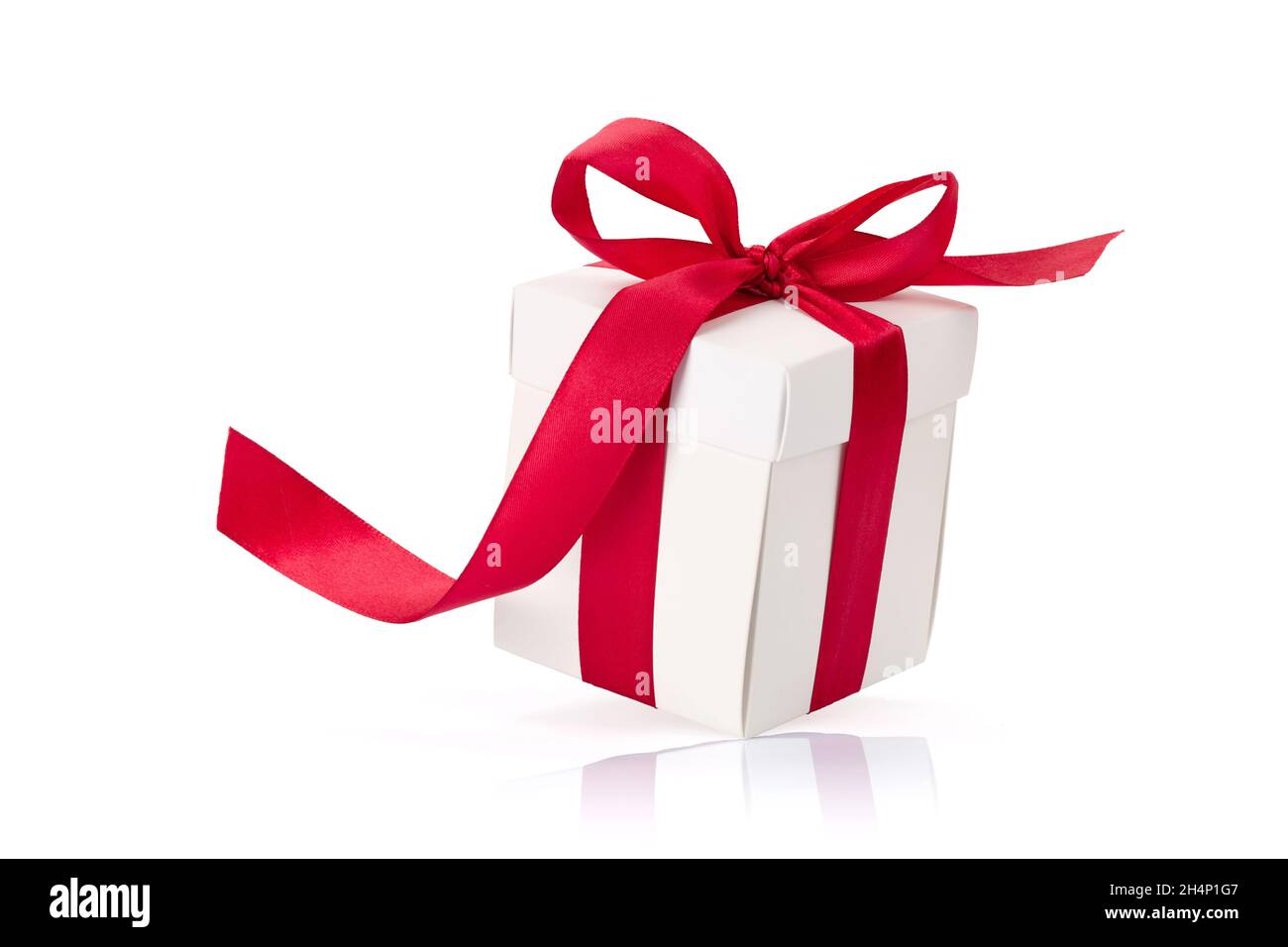 White gift box with red ribbon isolated on white background Stock Photo ...