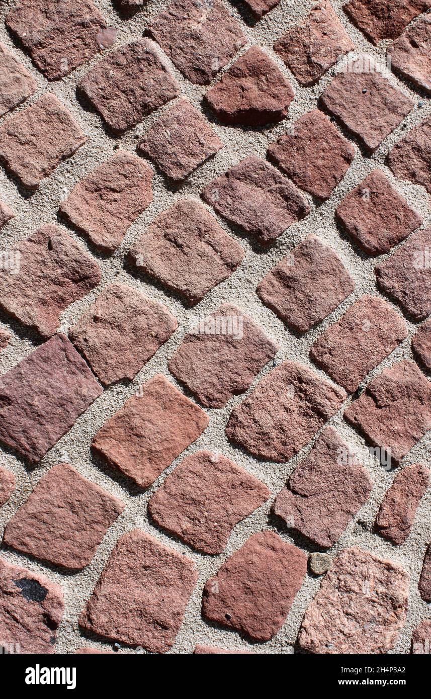 Close up of a red cobblestone walkway Stock Photo - Alamy