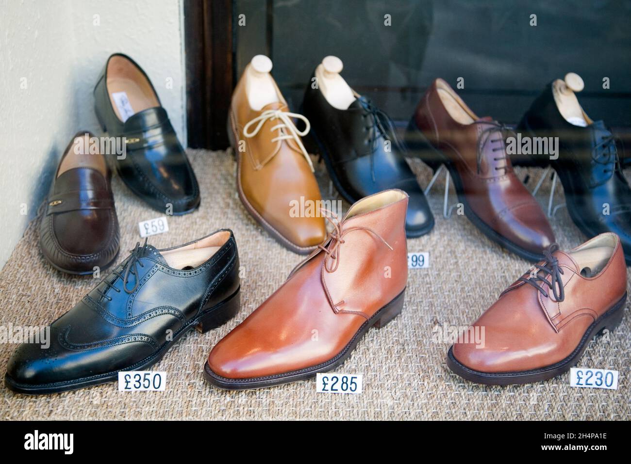 Jolly nice, if you like boring... expensive hand-made men's shoes in a  bespoke shop window in central Oxford. Are these prices for real? I'm  afraid so Stock Photo - Alamy