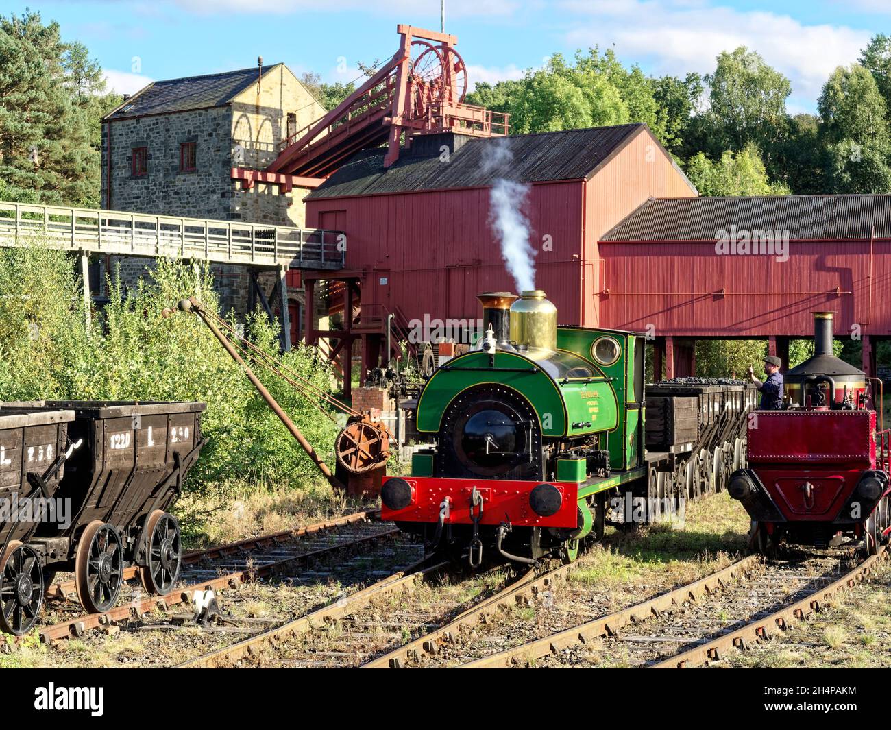 Beamish Museum colliery railway with typical working scenes being recreated for a charter event - Peckett loco with chaldron wagons at the pit head. Stock Photo