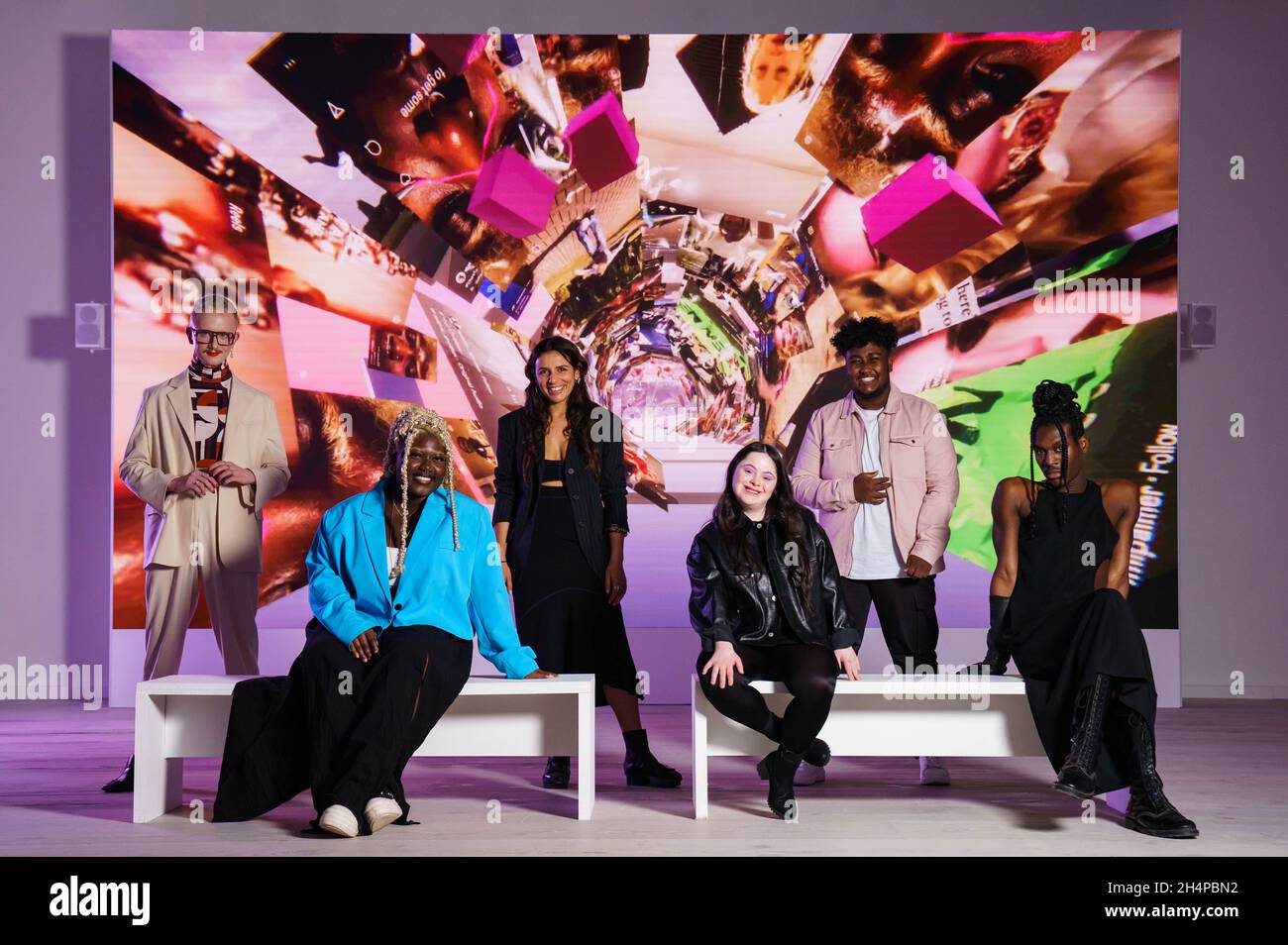 EDITORIAL USE ONLY Artist and founder of HERVISIONS, Zaiba Jabbar (3rd left) with other creators (left to right), Jamie Windust, Myla, Ellie Goldstein, Akafi Ali and Otamere Guobadia at the launch of Instagram's 'Yours to Make' artwork, which has been created by HERVISIONS to celebrate British youth culture in 2021, at Saatchi Gallery in London. Issue date: Thursday November 4, 2021. Stock Photo