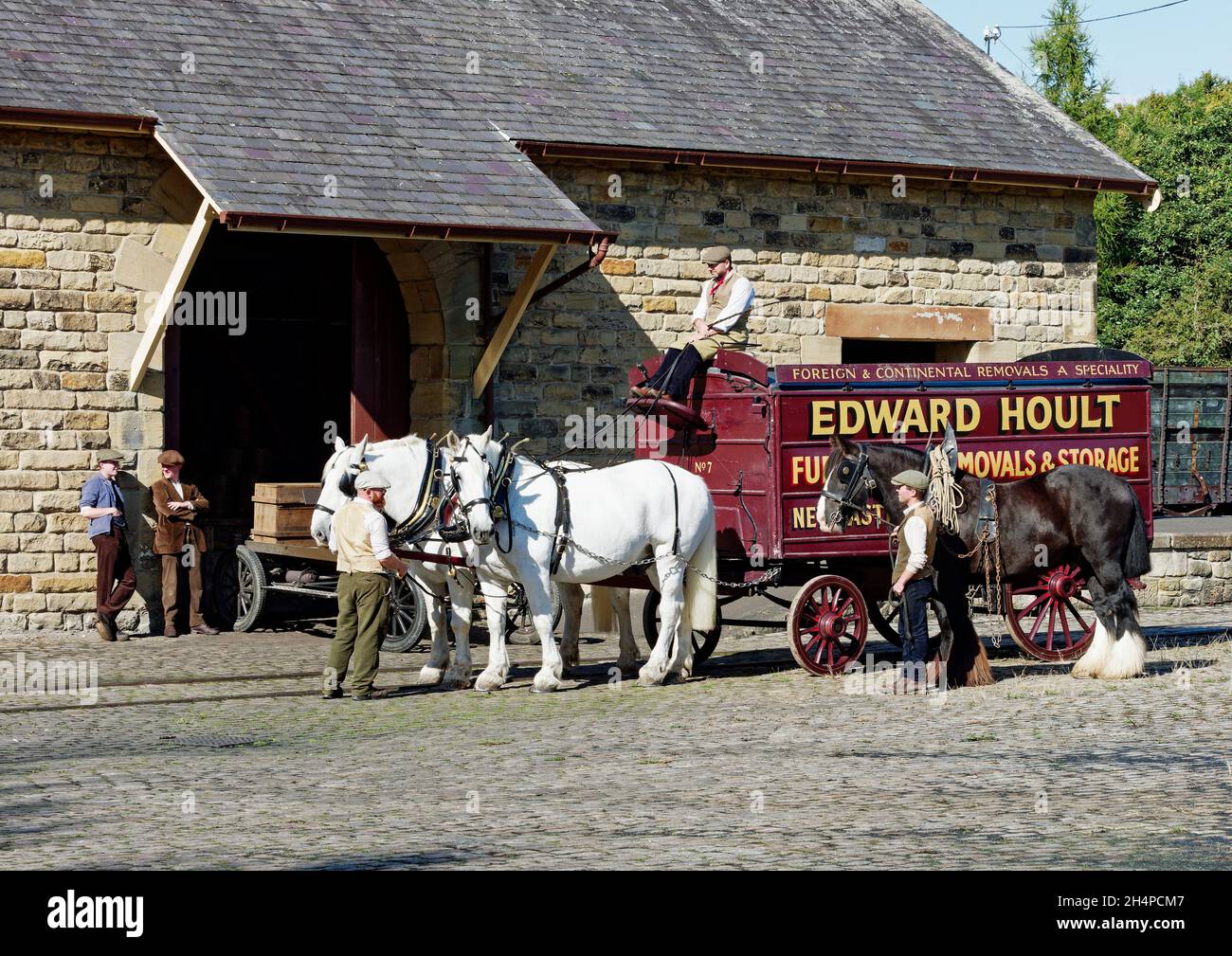 A horse-drawn van in a 1920's scene recreated at Rowley Station yard at Beamish Museum, County Durham. Stock Photo