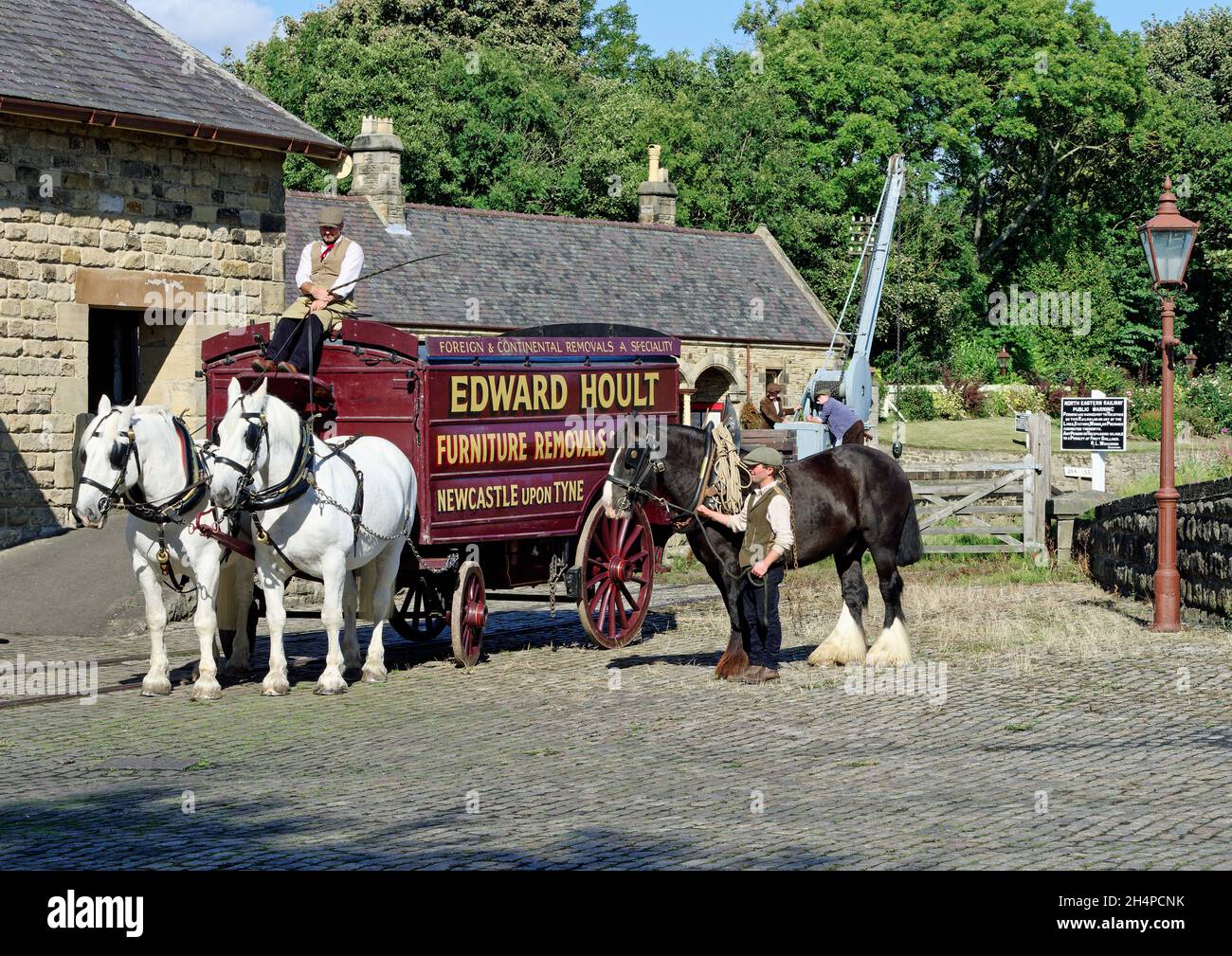 A horse-drawn van in a 1920's scene recreated at Rowley Station yard at Beamish Museum, County Durham. Stock Photo