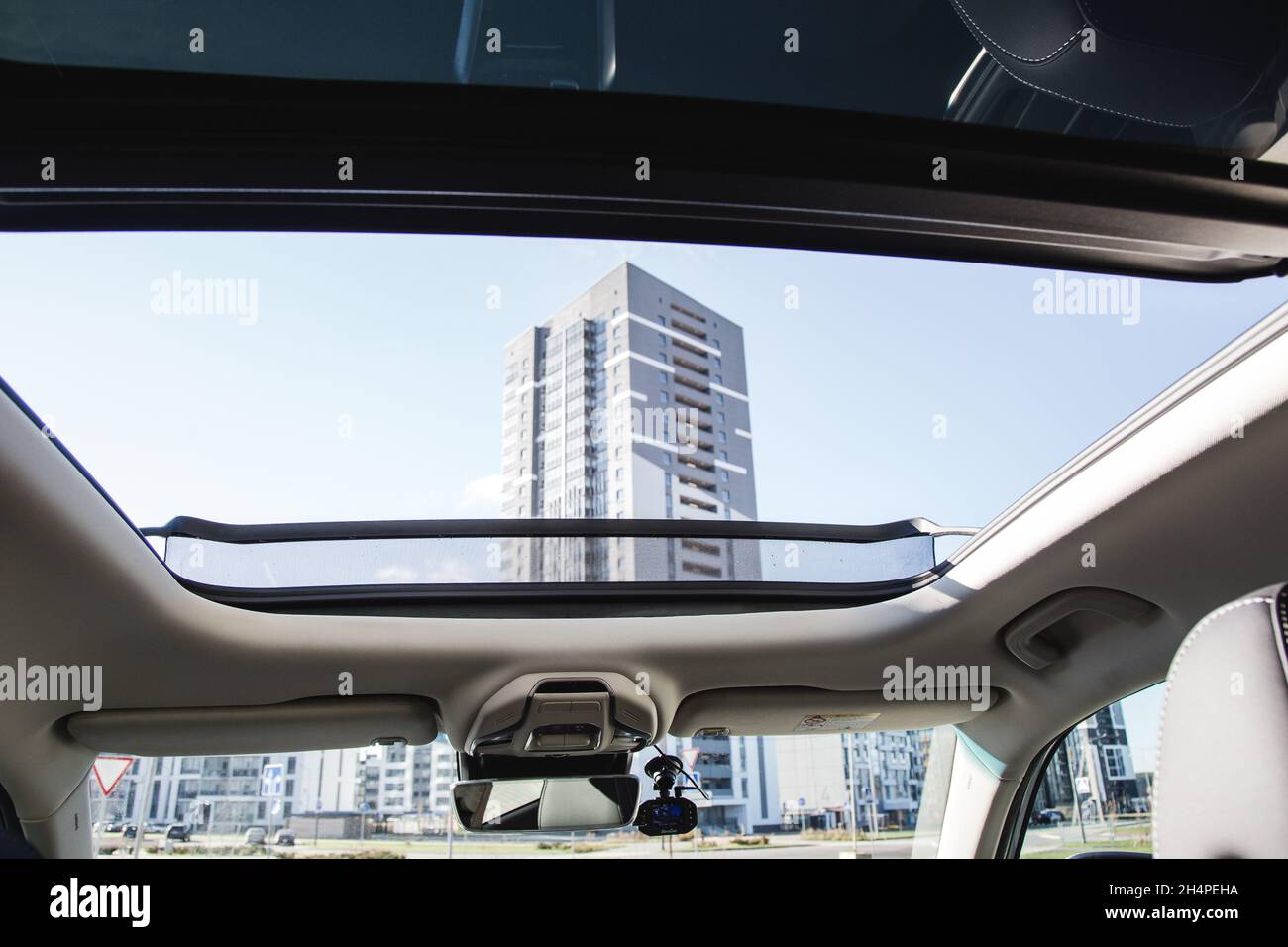 Panoramic roof, dashboard. The view from the empty car trunk with folded rear seats. Stock Photo