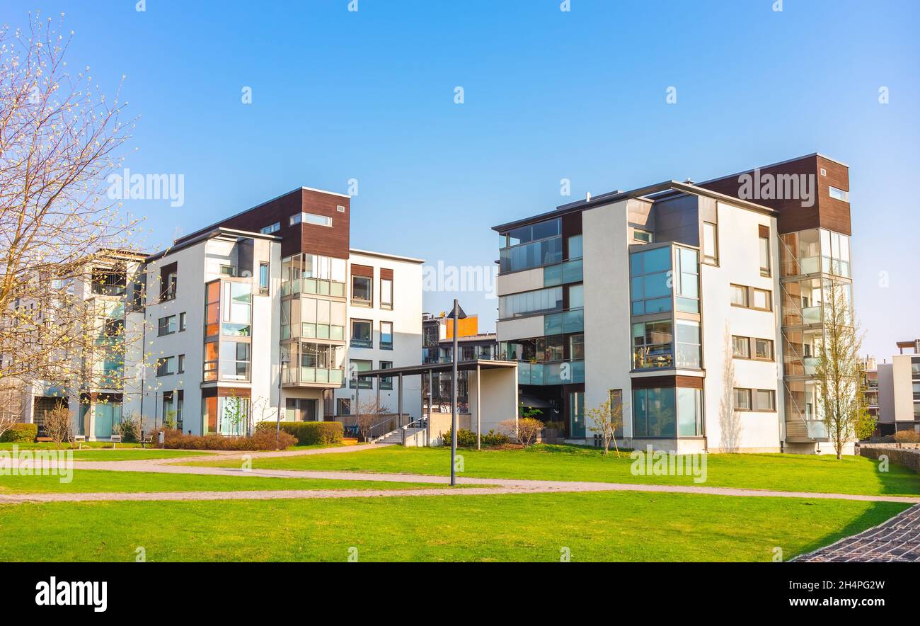 European residential complex of apartment buildings. Outdoor facilities. Eco-friendly living in city. Modern block of flats. Scandinavian architecture Stock Photo