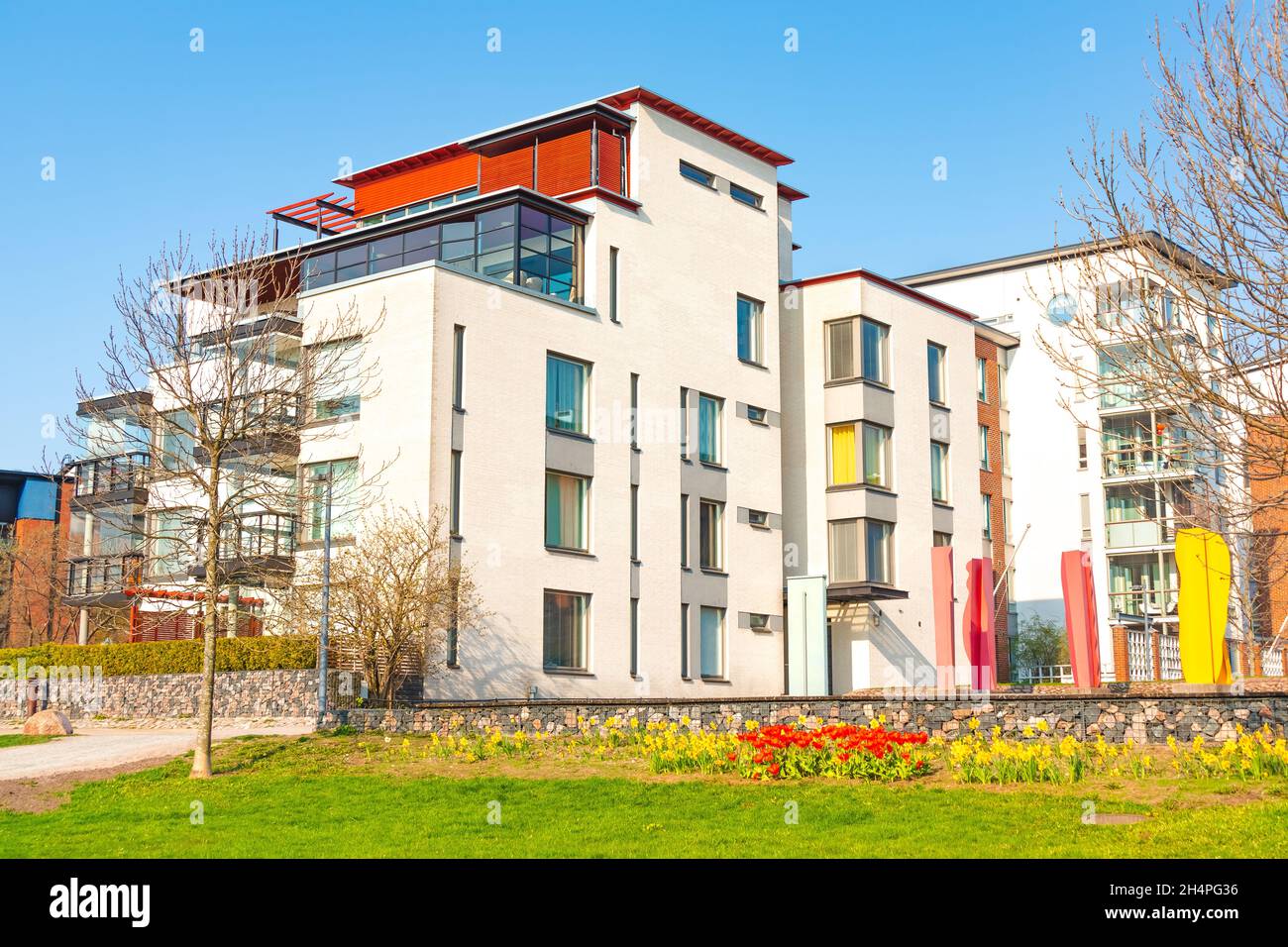 Modern complex of residential apartment buildings with green area in