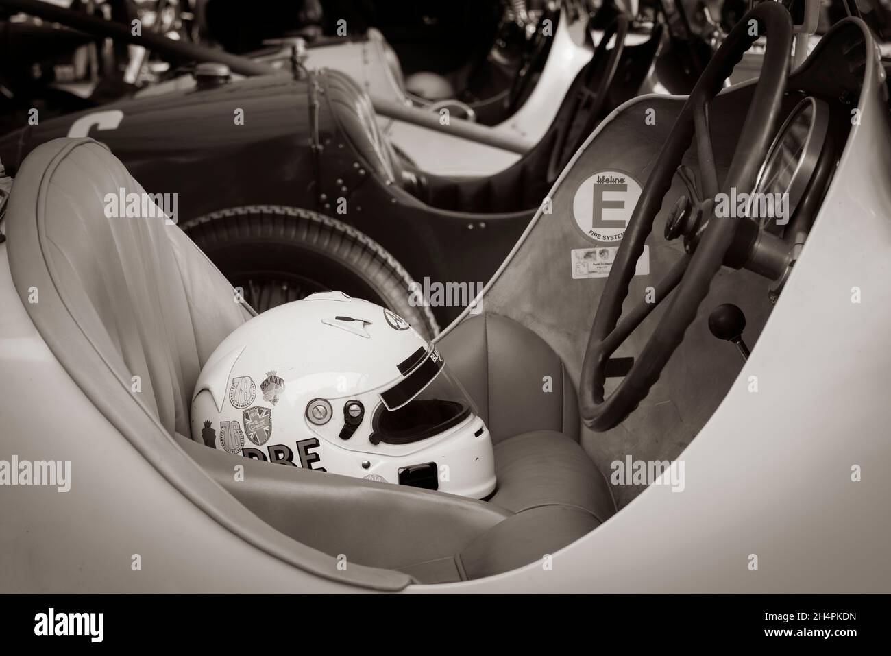 Bugatti cockpit with helmet on the seat. In the paddock at the Goodwood 78th Members Meeting, Sussex, UK. Stock Photo
