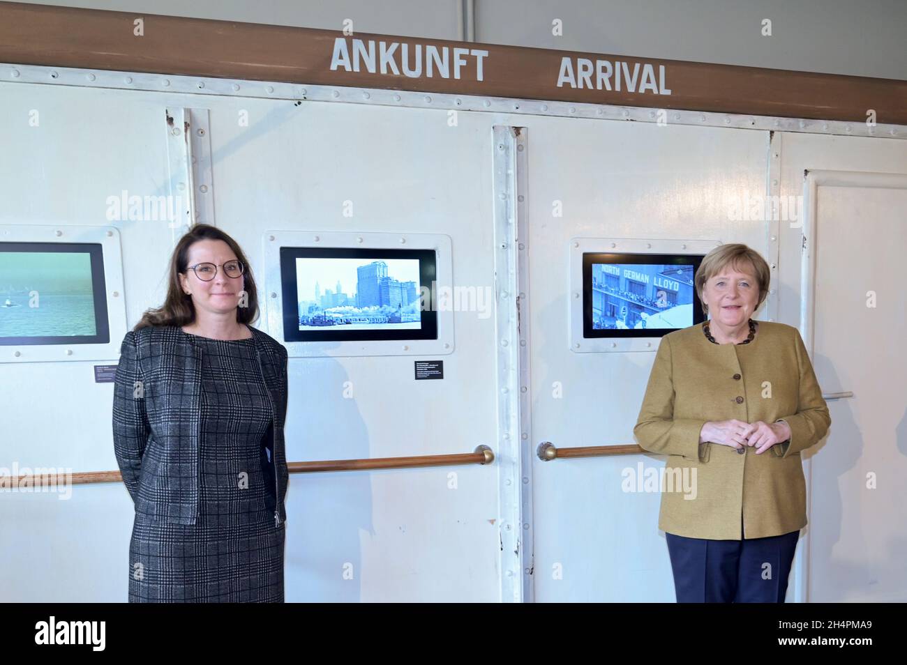 Bremerhaven, Germany. 04th Nov, 2021. The outgoing German Chancellor Angela Merkel (CDU, r) stands next to Director Simone Blaschka at the Migration Museum Deutsches Auswandererhaus. The outgoing Chancellor has arrived in Bremerhaven for her farewell visit. Credit: Fabian Bimmer/Reuters Pool X02840/dpa/Alamy Live News Stock Photo