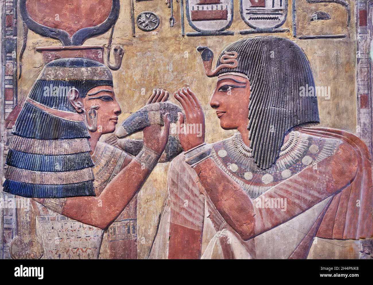 Ancient Egyptian tomb relief mural of Seti I and goddess Hathor, 1294-1279, KV17 Tomb of Seti I Vally of Kings Thebes. Louvre Museum B7 or N124. Decor Stock Photo