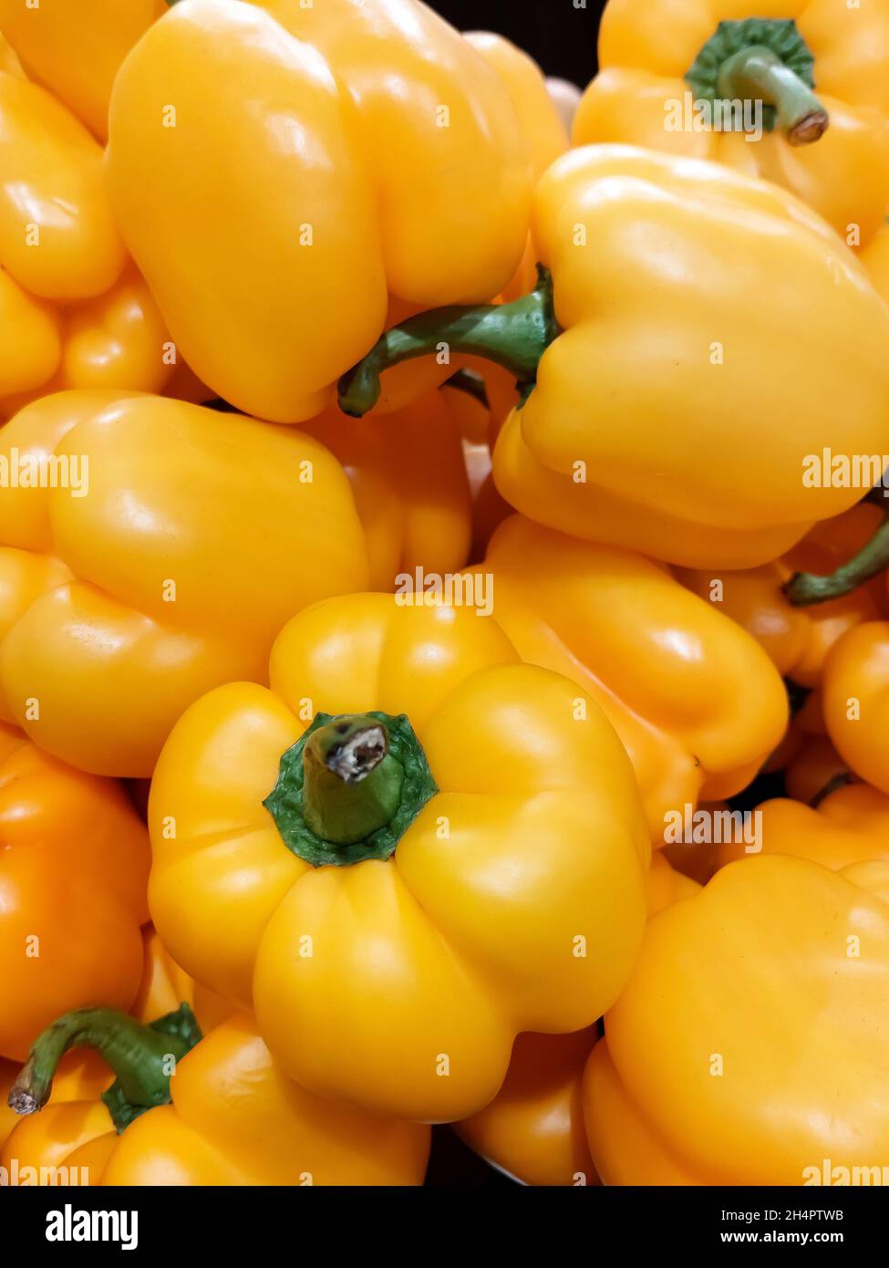 Yellow bell peppers, organic vegetables, paprika. Healthy vegetarian food concept. Market product Stock Photo