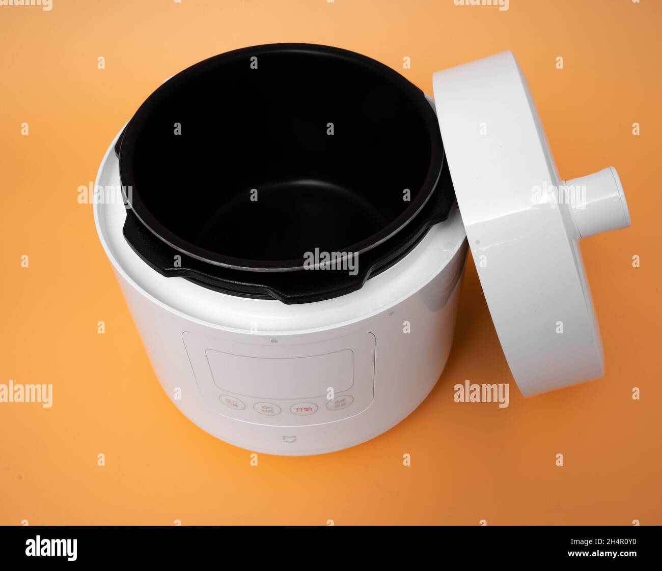 Germany, Berlin - 08.08.2021 : Xiaomi Mi Mijia Smart Pressure Cooker on yellow background Stock Photo