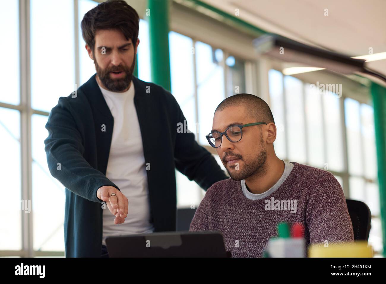 Two diverse businessmen working together on a digital tablet Stock Photo