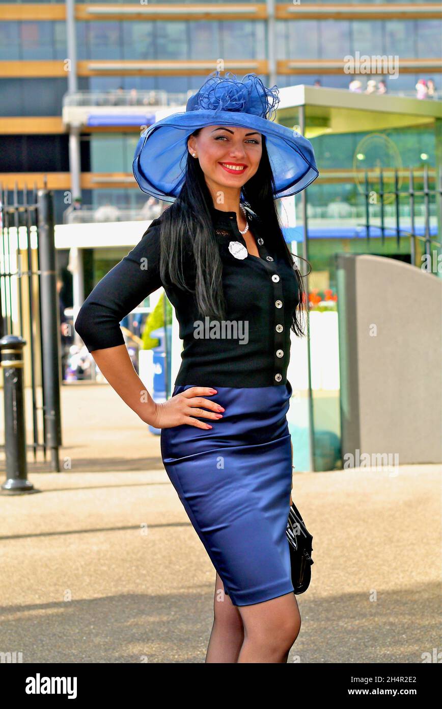 Pretty woman in a beautiful pose after attending Royal Ascot 2012 Stock Photo