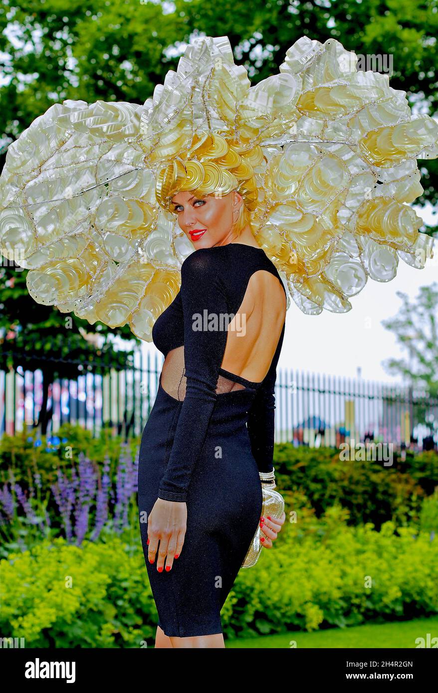 Glamorous lady wears a spectacular hat at Ladies Day Stock Photo