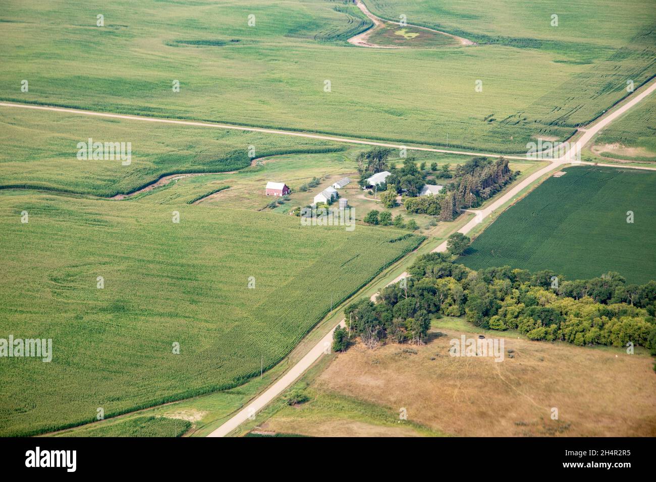 Aerial view of fields full of crops and farm houses in rural South