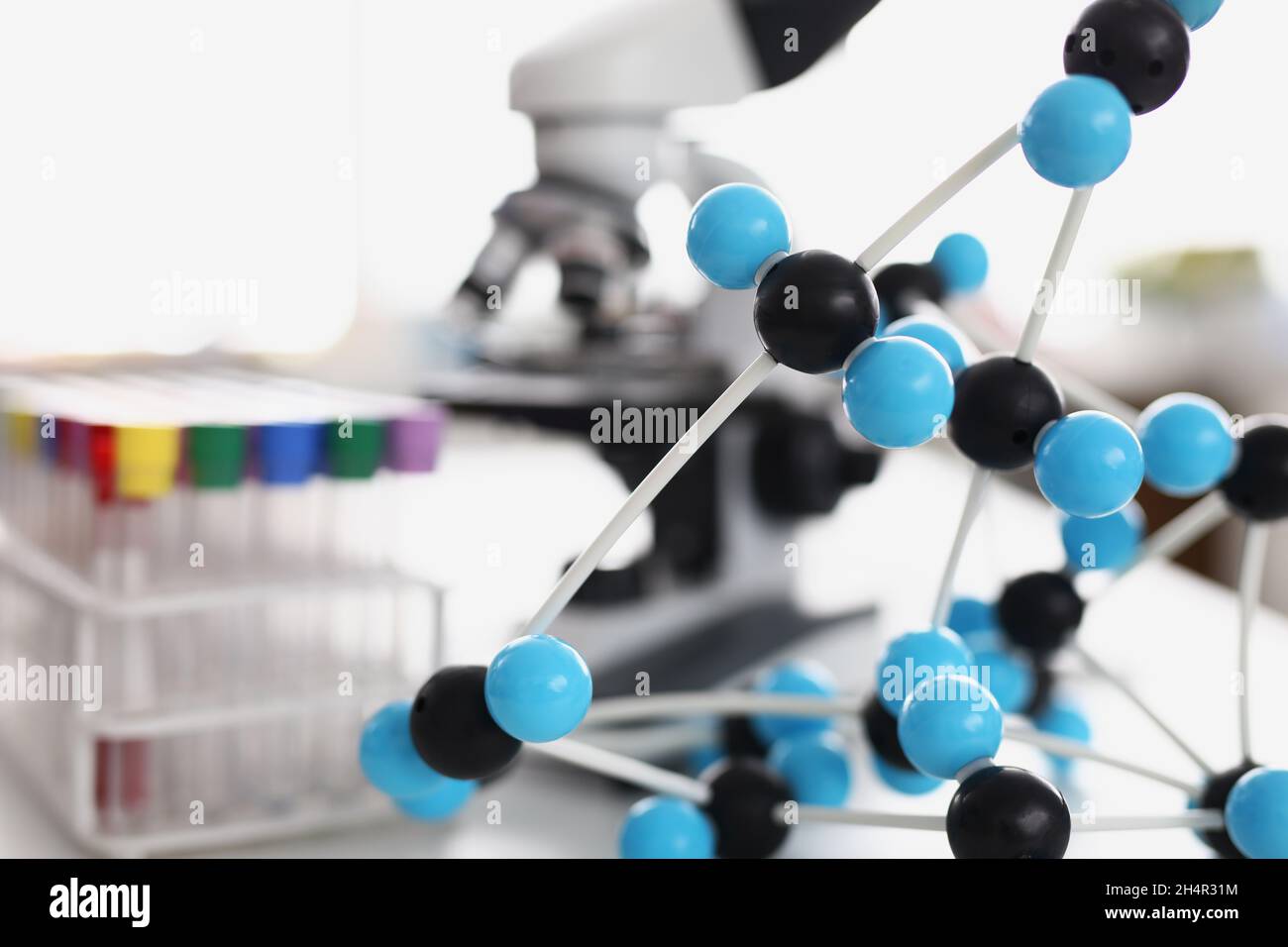 Glass tubes with colourful covers Stock Photo